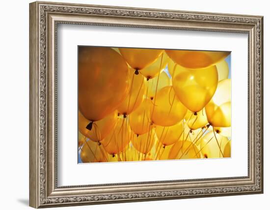 Bright Yellow Balloons Backlit in Sky Background-logoboom-Framed Photographic Print