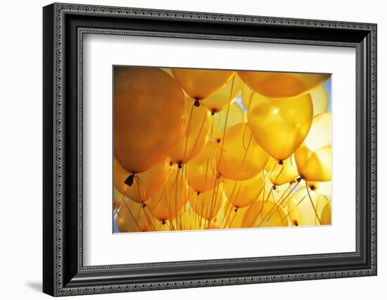 Bright Yellow Balloons Backlit in Sky Background-logoboom-Framed Photographic Print