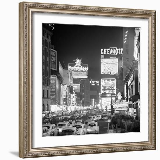 Brightly Lit Signs Shining over Traffic Going Down Broadway Towards Times Square-Andreas Feininger-Framed Photographic Print