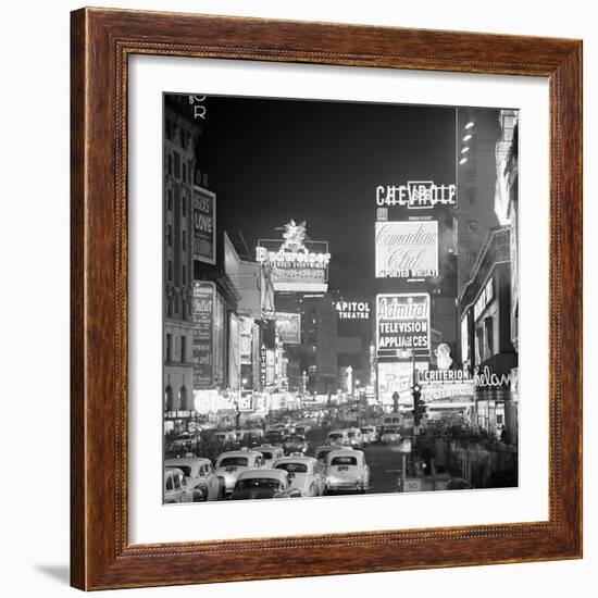 Brightly Lit Signs Shining over Traffic Going Down Broadway Towards Times Square-Andreas Feininger-Framed Photographic Print