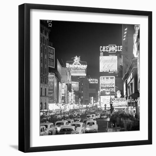 Brightly Lit Signs Shining over Traffic Going Down Broadway Towards Times Square-Andreas Feininger-Framed Photographic Print
