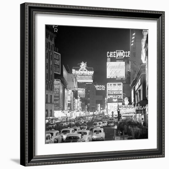 Brightly Lit Signs Shining over Traffic Going Down Broadway Towards Times Square-Andreas Feininger-Framed Photographic Print