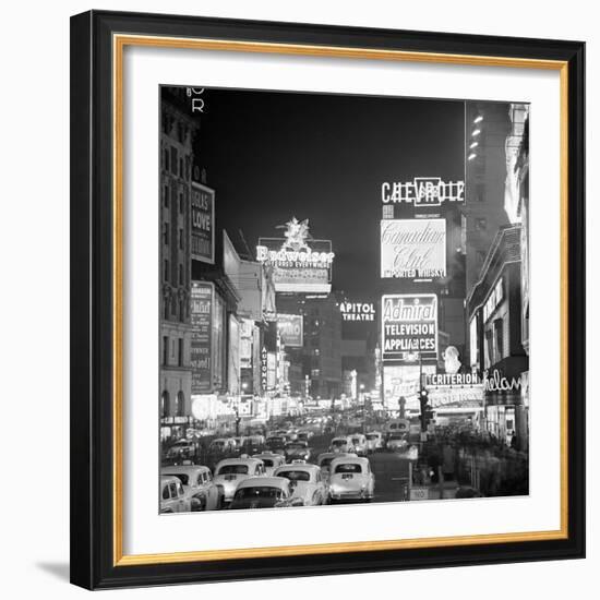 Brightly Lit Signs Shining over Traffic Going Down Broadway Towards Times Square-Andreas Feininger-Framed Photographic Print