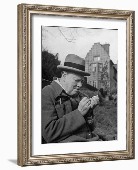 Britain's Prime Minister Winston Churchill Lighting a Cigar-null-Framed Photographic Print