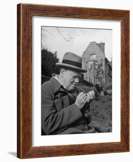 Britain's Prime Minister Winston Churchill Lighting a Cigar-null-Framed Photographic Print