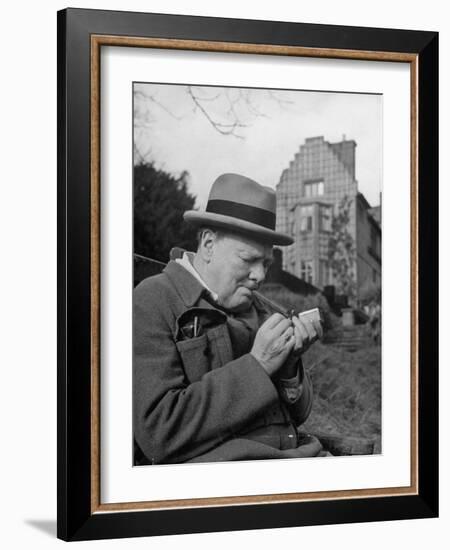 Britain's Prime Minister Winston Churchill Lighting a Cigar-null-Framed Photographic Print