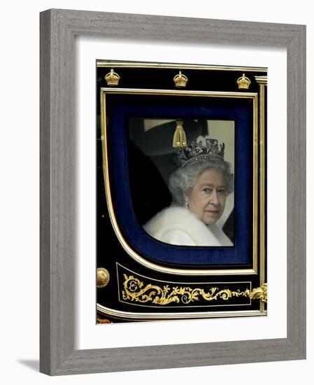 Britain's Queen Elizabeth II Arrives Back at Buckingham Palace in Her State Coach-null-Framed Photographic Print