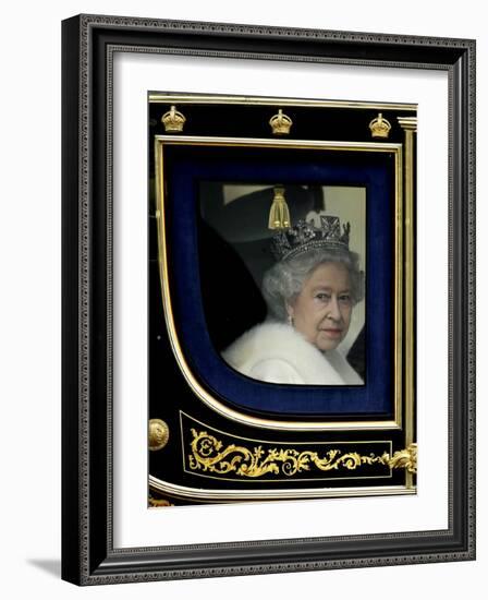 Britain's Queen Elizabeth II Arrives Back at Buckingham Palace in Her State Coach-null-Framed Photographic Print