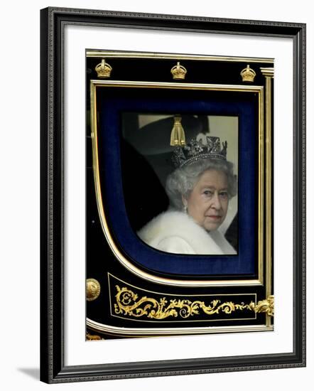 Britain's Queen Elizabeth II Arrives Back at Buckingham Palace in Her State Coach-null-Framed Photographic Print