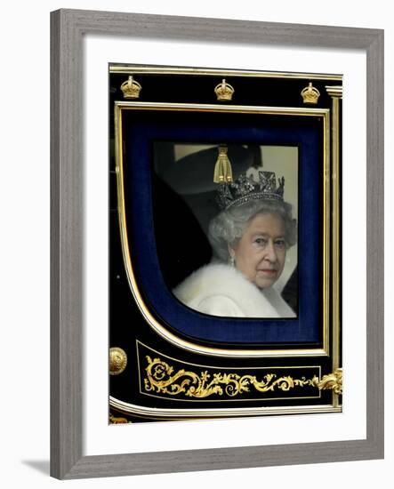 Britain's Queen Elizabeth II Arrives Back at Buckingham Palace in Her State Coach-null-Framed Photographic Print