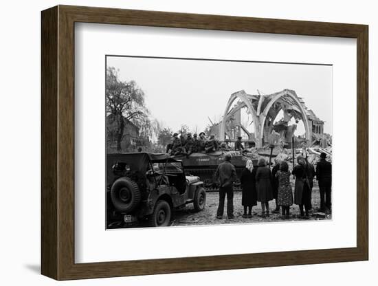 British 49th Armoured Personnel Carrier Regiment Tank Passes Civilians and a Damaged Church-George Silk-Framed Photographic Print