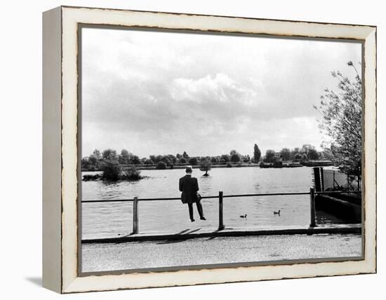 British Actor Alec Guinness Sitting Alone by Lake in a Park-Cornell Capa-Framed Premier Image Canvas