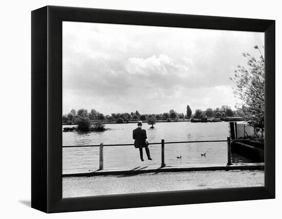 British Actor Alec Guinness Sitting Alone by Lake in a Park-Cornell Capa-Framed Premier Image Canvas