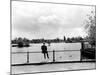 British Actor Alec Guinness Sitting Alone by Lake in a Park-Cornell Capa-Mounted Premium Photographic Print