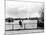 British Actor Alec Guinness Sitting Alone by Lake in a Park-Cornell Capa-Mounted Premium Photographic Print