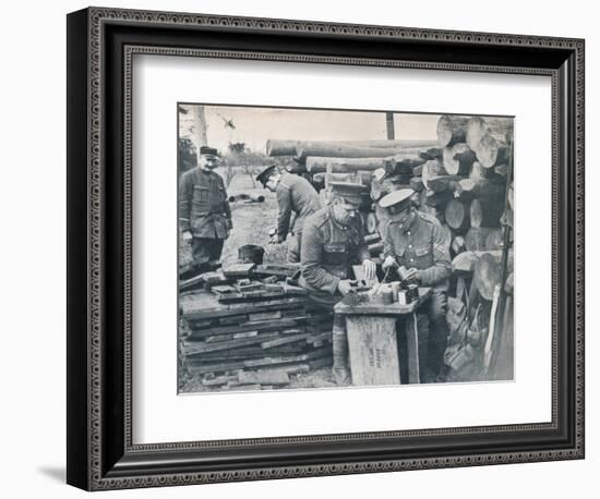 British engineers with the Expeditionary Force making hand grenades out of tobacco tins, c1914-Unknown-Framed Photographic Print