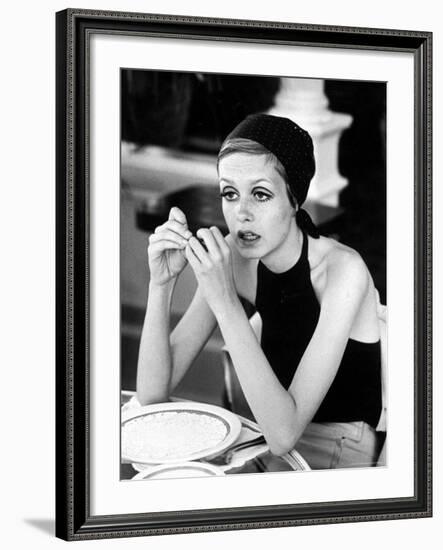 British Fashion Model Twiggy with Slumpy Posture, at Table in Restaurant at Disneyland-Ralph Crane-Framed Premium Photographic Print