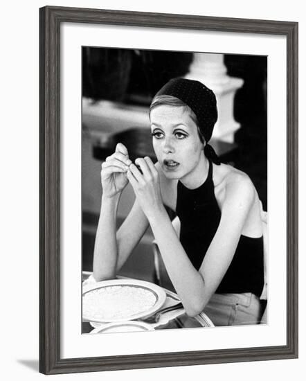 British Fashion Model Twiggy with Slumpy Posture, at Table in Restaurant at Disneyland-Ralph Crane-Framed Premium Photographic Print