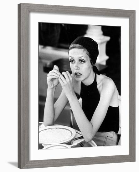 British Fashion Model Twiggy with Slumpy Posture, at Table in Restaurant at Disneyland-Ralph Crane-Framed Premium Photographic Print