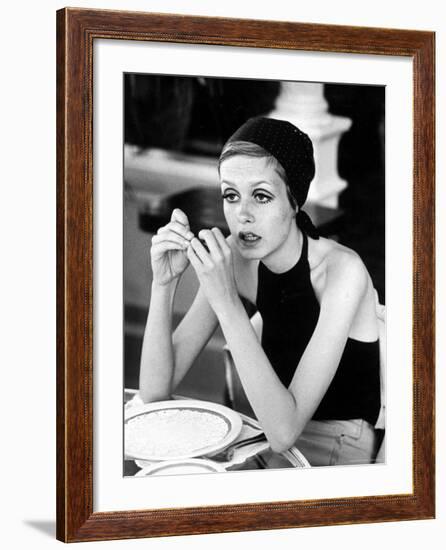 British Fashion Model Twiggy with Slumpy Posture, at Table in Restaurant at Disneyland-Ralph Crane-Framed Premium Photographic Print