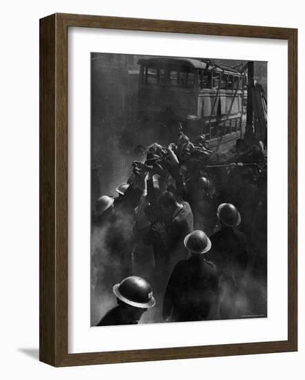 British Female Casualty of German Robot Bombing Being Lifted on Stretcher by Rescue Squad-George Rodger-Framed Photographic Print