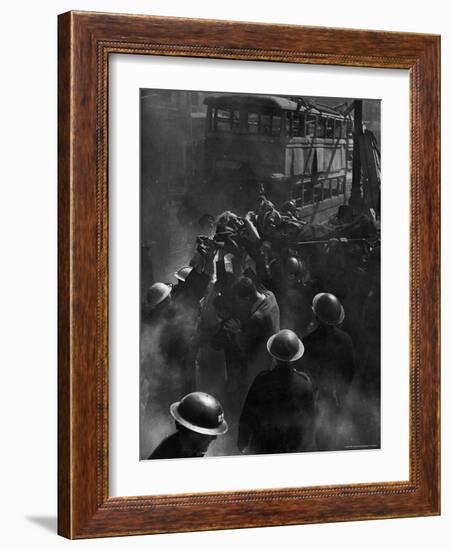 British Female Casualty of German Robot Bombing Being Lifted on Stretcher by Rescue Squad-George Rodger-Framed Photographic Print