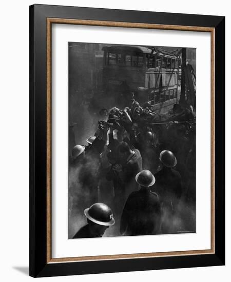 British Female Casualty of German Robot Bombing Being Lifted on Stretcher by Rescue Squad-George Rodger-Framed Photographic Print