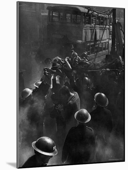 British Female Casualty of German Robot Bombing Being Lifted on Stretcher by Rescue Squad-George Rodger-Mounted Photographic Print