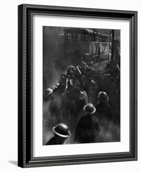 British Female Casualty of German Robot Bombing Being Lifted on Stretcher by Rescue Squad-George Rodger-Framed Photographic Print