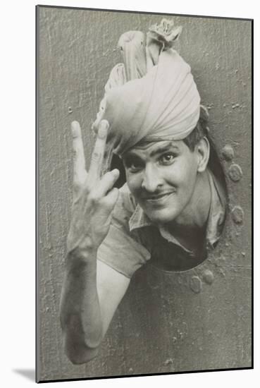 British Indian Soldier He Gives the 'V' Sign from a Port-Hole of a Ship on Arrival in Singapore-null-Mounted Photo
