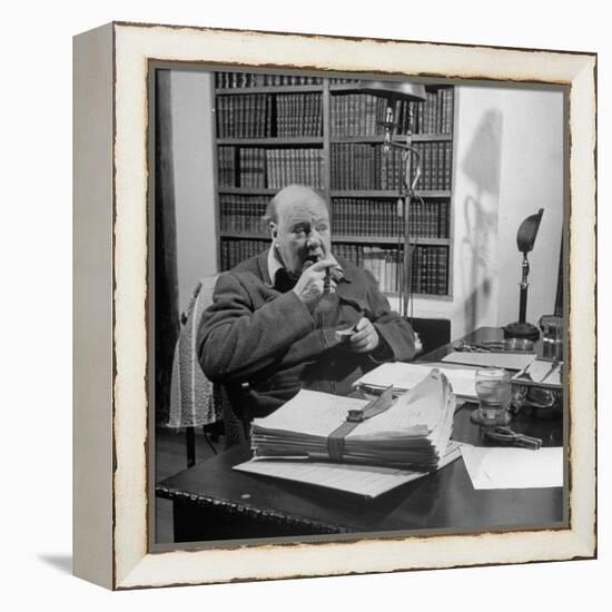 British Leader Winston Churchill Smoking a Cigar at His Desk-Nat Farbman-Framed Premier Image Canvas