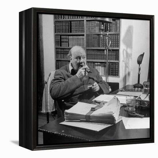 British Leader Winston Churchill Smoking a Cigar at His Desk-Nat Farbman-Framed Premier Image Canvas