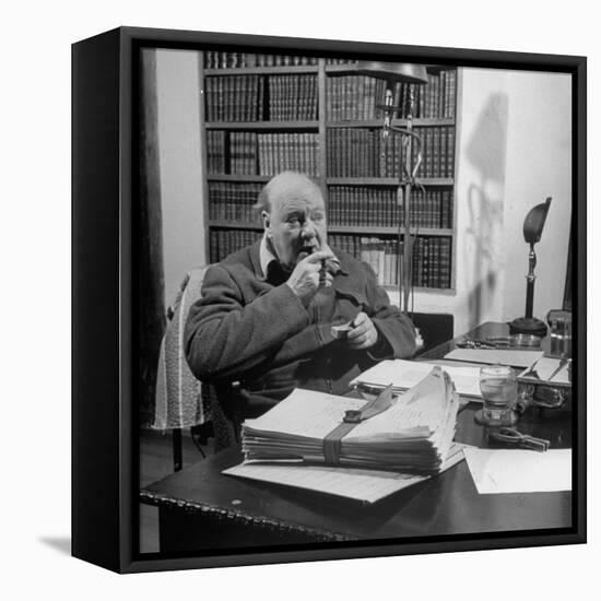 British Leader Winston Churchill Smoking a Cigar at His Desk-Nat Farbman-Framed Premier Image Canvas