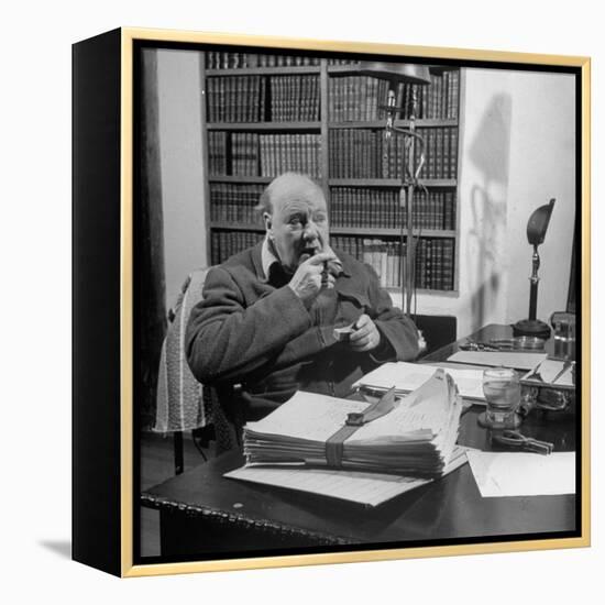 British Leader Winston Churchill Smoking a Cigar at His Desk-Nat Farbman-Framed Premier Image Canvas