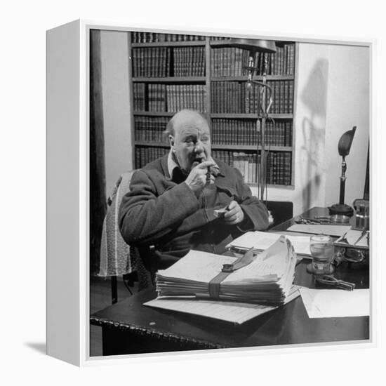 British Leader Winston Churchill Smoking a Cigar at His Desk-Nat Farbman-Framed Premier Image Canvas