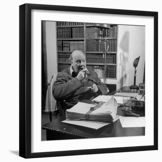 British Leader Winston Churchill Smoking a Cigar at His Desk-Nat Farbman-Framed Premium Photographic Print