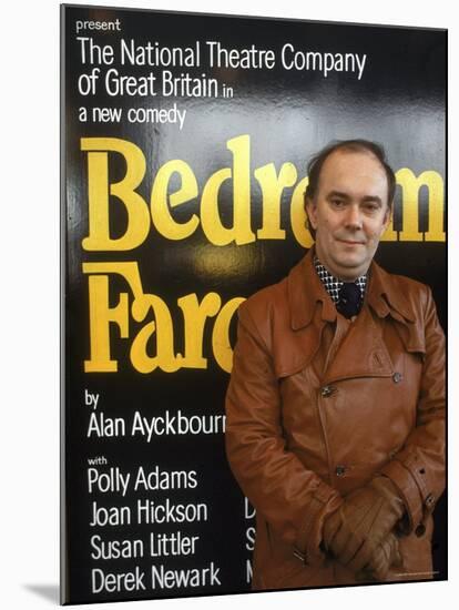 British Playwright Alan Ayckbourn Standing Before Broadway Poster of His Comedy "Bedroom Farce."-Ted Thai-Mounted Premium Photographic Print
