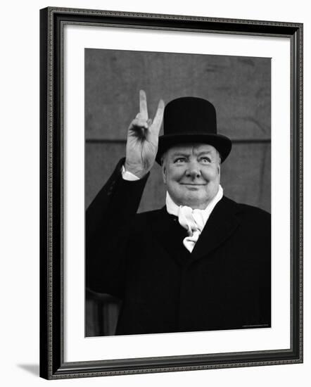 British Pm Winston Churchill Sporting Top Hat with Coat and Scarf as He Holds Up Veed Fingers-Alfred Eisenstaedt-Framed Premium Photographic Print