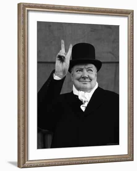 British Pm Winston Churchill Sporting Top Hat with Coat and Scarf as He Holds Up Veed Fingers-Alfred Eisenstaedt-Framed Premium Photographic Print