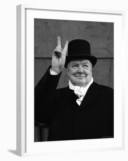 British Pm Winston Churchill Sporting Top Hat with Coat and Scarf as He Holds Up Veed Fingers-Alfred Eisenstaedt-Framed Premium Photographic Print