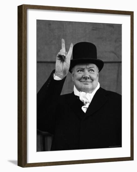 British Pm Winston Churchill Sporting Top Hat with Coat and Scarf as He Holds Up Veed Fingers-Alfred Eisenstaedt-Framed Premium Photographic Print