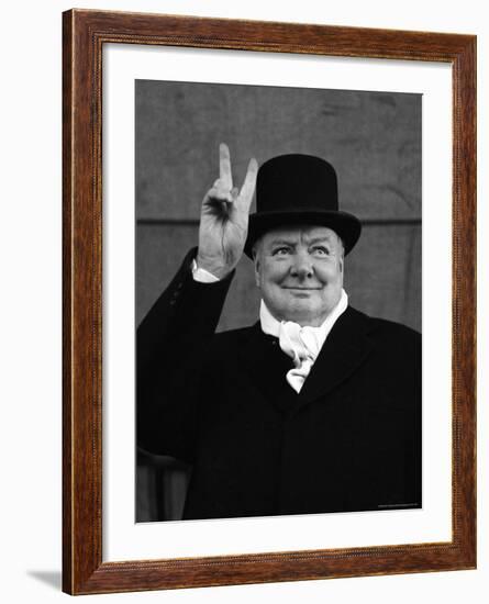 British Pm Winston Churchill Sporting Top Hat with Coat and Scarf as He Holds Up Veed Fingers-Alfred Eisenstaedt-Framed Premium Photographic Print