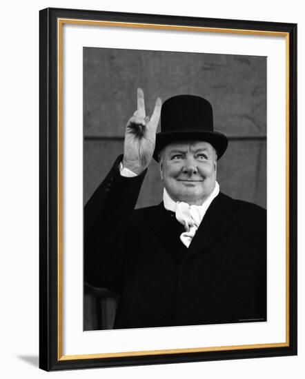 British Pm Winston Churchill Sporting Top Hat with Coat and Scarf as He Holds Up Veed Fingers-Alfred Eisenstaedt-Framed Premium Photographic Print