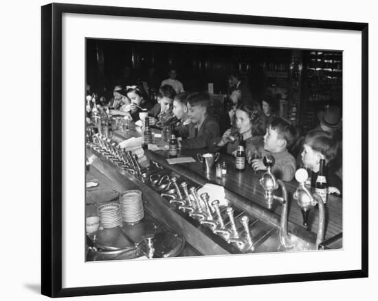 British Refugee Children Eating Ice Cream and Drinking Ginger Ale at a Soda Fountain-John Phillips-Framed Premium Photographic Print