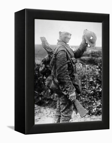 British Soldier with Bandaged Head Shows the Steel Helmet That Saved His Li-English Photographer-Framed Premier Image Canvas