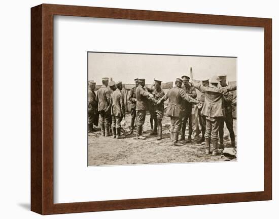 British soldiers searching captured German prisoners, Somme campaign, France, World War I, 1916-Unknown-Framed Photographic Print