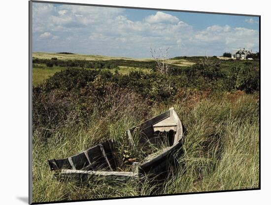 Broken Old Rowboat Cushioned in Tall Wild Grass, with a View of a House in Distance-Alfred Eisenstaedt-Mounted Photographic Print
