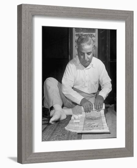 Broker Astrologer Reading Horoscope While Trading at Bombay Stock Exchange-Margaret Bourke-White-Framed Photographic Print