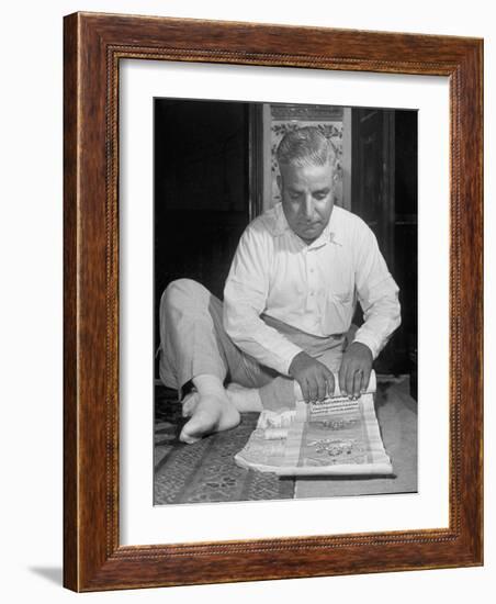 Broker Astrologer Reading Horoscope While Trading at Bombay Stock Exchange-Margaret Bourke-White-Framed Photographic Print