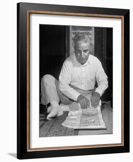 Broker Astrologer Reading Horoscope While Trading at Bombay Stock Exchange-Margaret Bourke-White-Framed Photographic Print